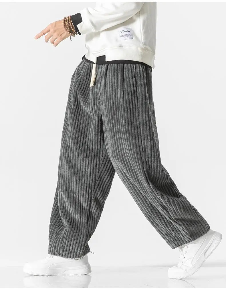 "Zwarte geribbelde relaxed fit broek, corduroy ontwerp, elastische taille, urban stijl, perfect voor casual dagen."