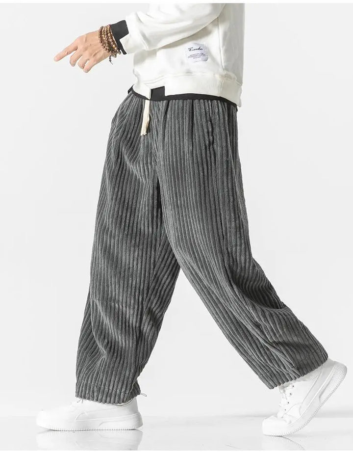 "Zwarte geribbelde relaxed fit broek, corduroy ontwerp, elastische taille, urban stijl, perfect voor casual dagen."
